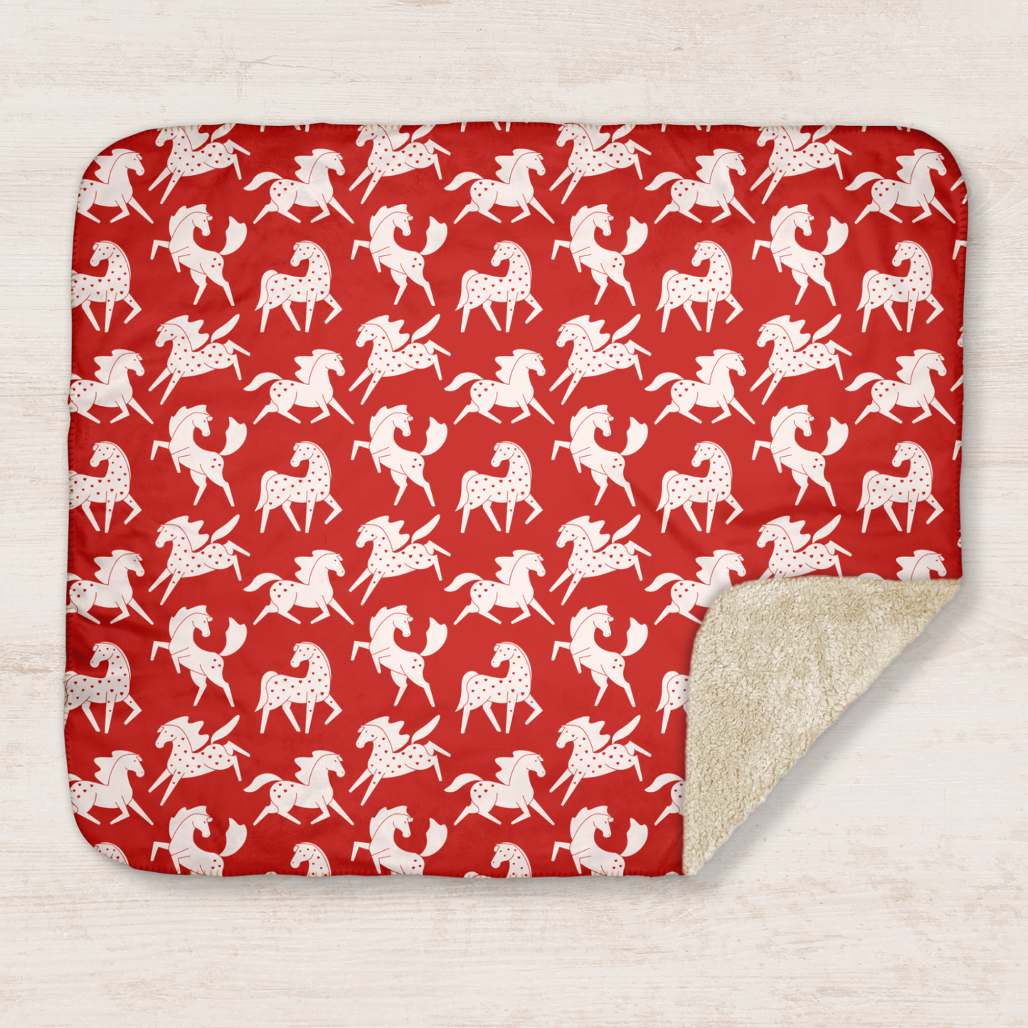 White Sweetheart Appaloosa on Red Sherpa Blanket